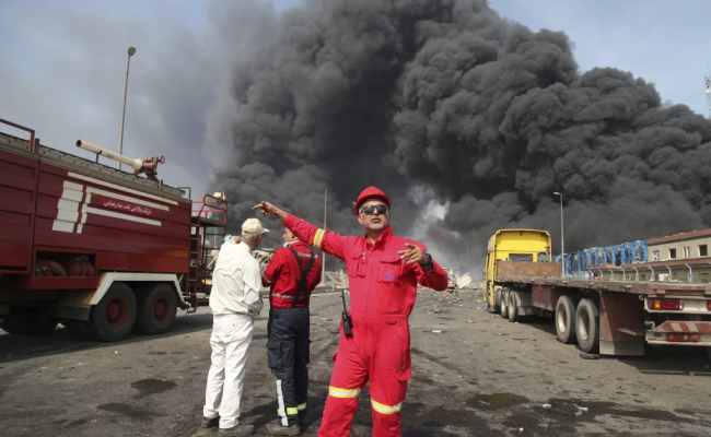 Iran raises death toll in port explosion to at least 14, as some 750 others injured